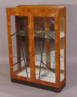 A walnut Art Deco style display cabinet