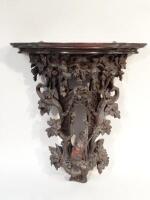 A 19thC Black Forest carved pine wall bracket