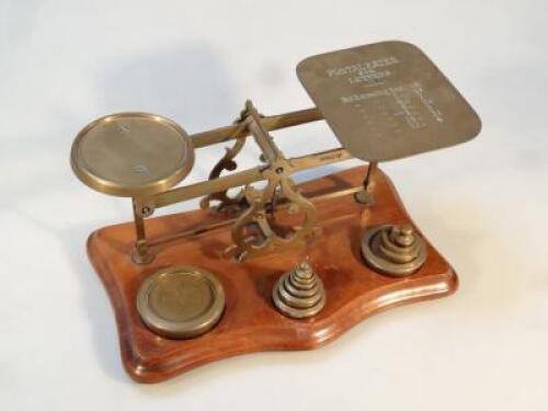 A set of brass postal scales