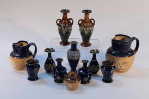 A small collection of Royal Doulton stoneware vases and jugs. (12