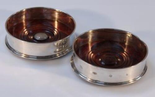 A pair of Elizabeth II silver wine coasters