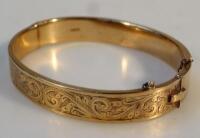 A 9ct gold flat hinged bangle