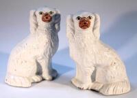 A pair of Staffordshire flat back spaniels