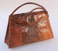 An early 20thC alligator skin handbag