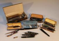 A quantity fountain pens and pencils