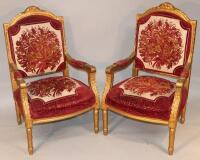 A pair of late 19thC/early 20thC giltwood armchairs