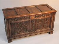 An oak four panelled coffer