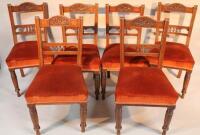 A set of six Edwardian oak dining chairs