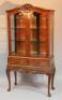 A 20thC walnut finished display cabinet