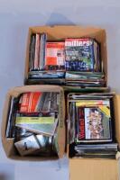 A quantity of various football programmes