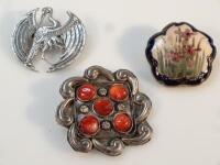 Three brooches