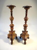 A pair of early 20thC metal altar sticks