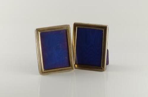 A pair of modern silver rectangular photograph frames