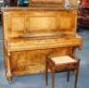 An early 20thC upright overstrung piano by E Krauss