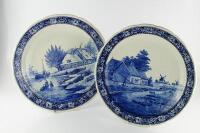 A pair of modern Delft blue and white chargers