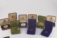 A collection of Queen Elizabeth II commemorative and other crowns