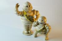 *A waving Michelin Man money bank.