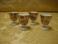 A set of 4 egg cups, of panelled form, 2 1/4" high, patt no 1128