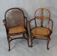 Two cane seated steam bent Victorian armchairs.