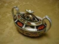 A 2-handled sugar bowl and cover