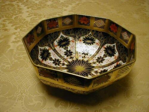An octagonal bowl, heavily gilt, 7 1/2" wide, patt no 1128, modern date mark