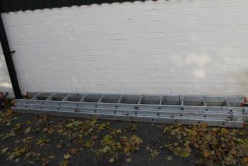 A three drawer set of aluminium step ladders.