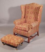 A modern Gascoigne wingback armchair in George III style