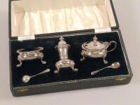 A silver three piece cruet