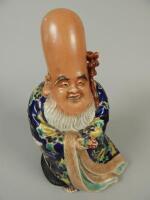 A 19thC oriental porcelain figure of an immortal