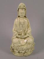 A reproduction Chinese Blanc De Chine porcelain figure of a Guan Yin