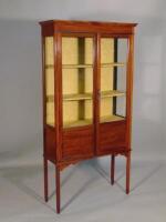 An Edwardian mahogany and chequer banded display cabinet