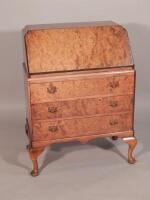 A walnut and burr walnut bureau