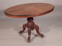 A Victorian oval and marquetry breakfast table