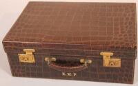 An early 20thC crocodile skin travelling case