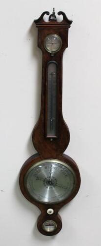 A George III flame mahogany wheel barometer