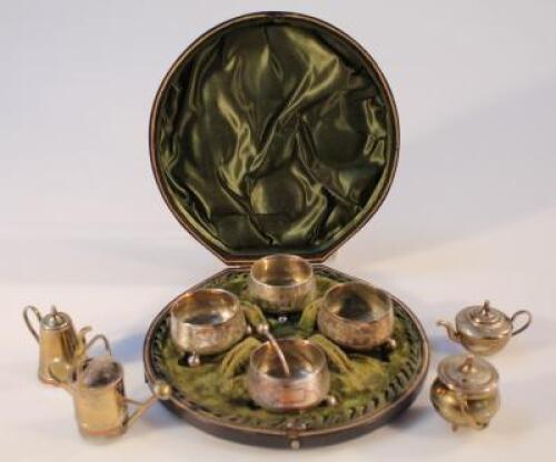 An early 20thC silver plated cased cruet set