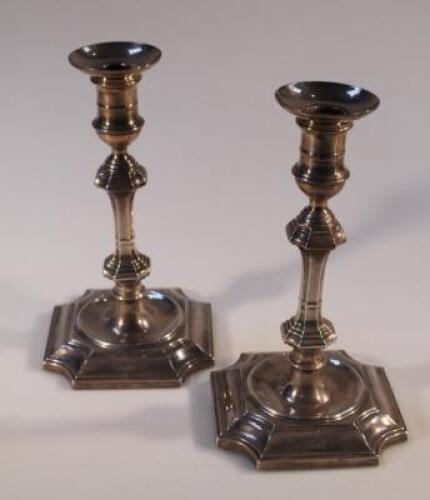 A pair of Edwardian silver candlesticks