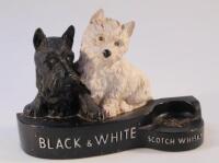 A resin Whyte and Mackay black and white whisky pub advertising group