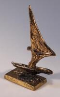 An early 20thC gilt bronzed model of a yacht