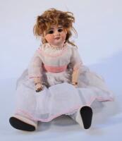 An early 20thC SFB J10 2/0 bisque headed doll