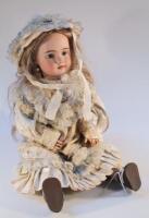 A late 19thC/early 20thC DEP bisque headed doll