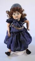 A late 19th/early 20thC Heubach-Koppelsdorf 320-4/0 bisque headed doll