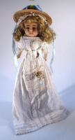 A mid 19thC wax headed doll