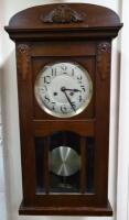 An early 20thC oak cased wall clock