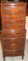 A 1930s walnut veneered narrow chest on chest