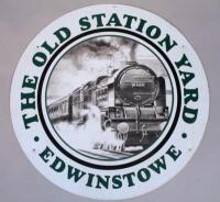 A circular railway sign