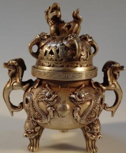 A Chinese silvered metal censer and cover