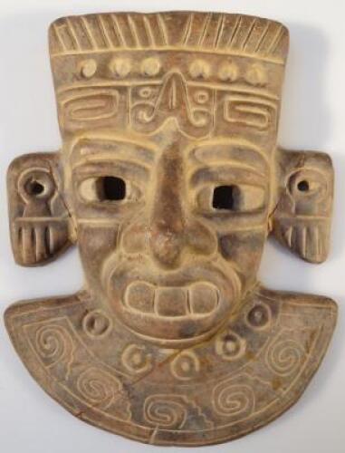 An Aztec design earthenware wall mask