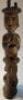 A heavily carved African tribal wooden totem figure