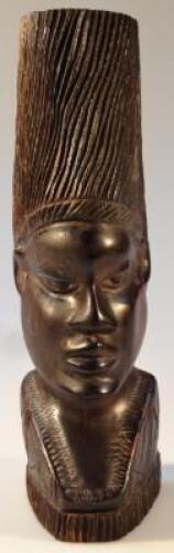 A heavily carved African tribal hardwood figure